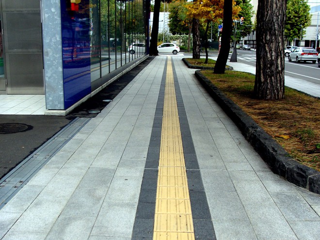 Tactile-Ground-Surface-Indicators.-Long-yellow-line-along-the-sidewalk-in-Sapporo-Japan